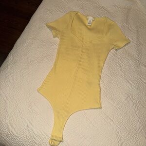 Women’s yellow bodysuit